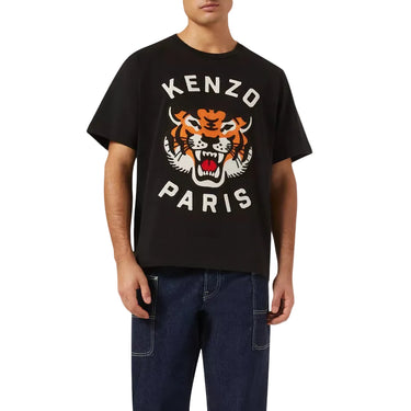 Person wearing a black Kenzo Paris t-shirt with a tiger logo on a white background