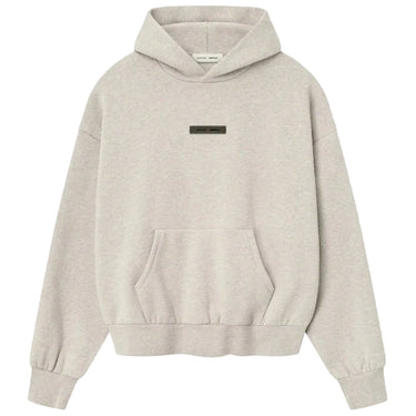 Beige hoodie with a small logo on a light gray background