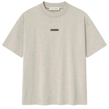 Beige t-shirt with a small logo on a white background