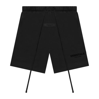 Black shorts with 'ESSENTIALS' branding on a white background